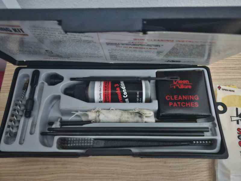 Two Gun cleaning Kits and Bore Light