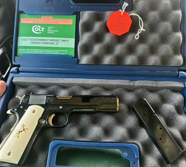 Factory engraved high gloss blue Colt 1911 