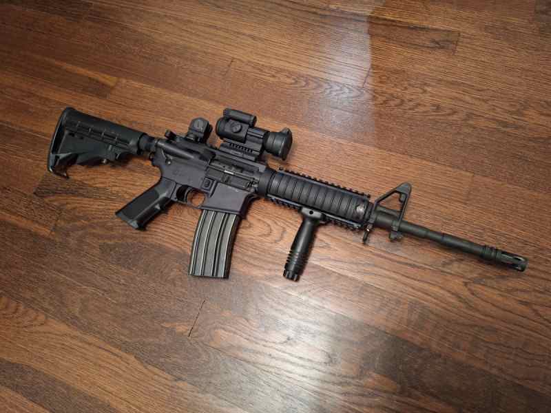 Bushmaster XM-15 E2S W/Aimpoint Pro